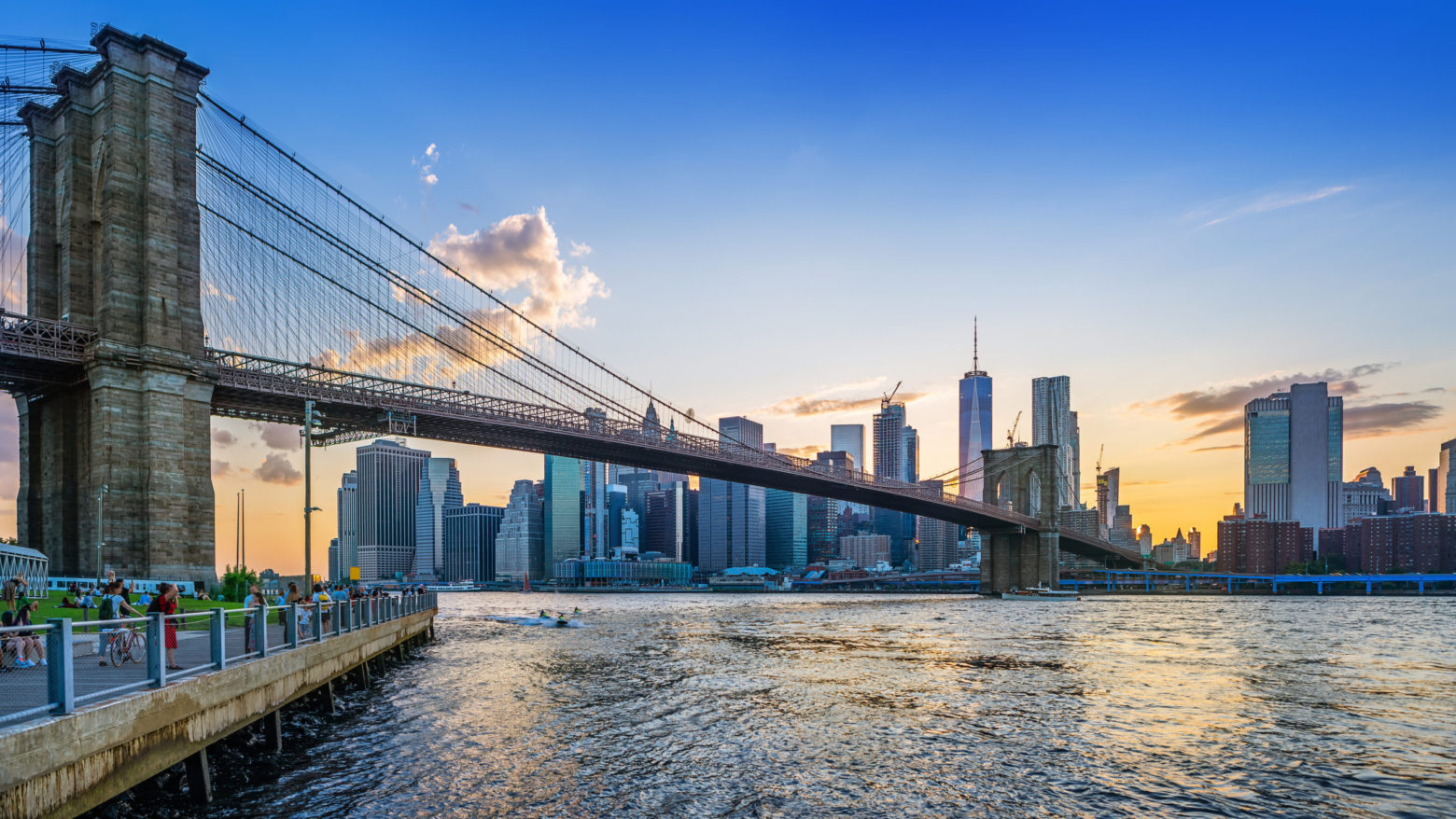 brooklyn bridge and lower manhattan while sunset